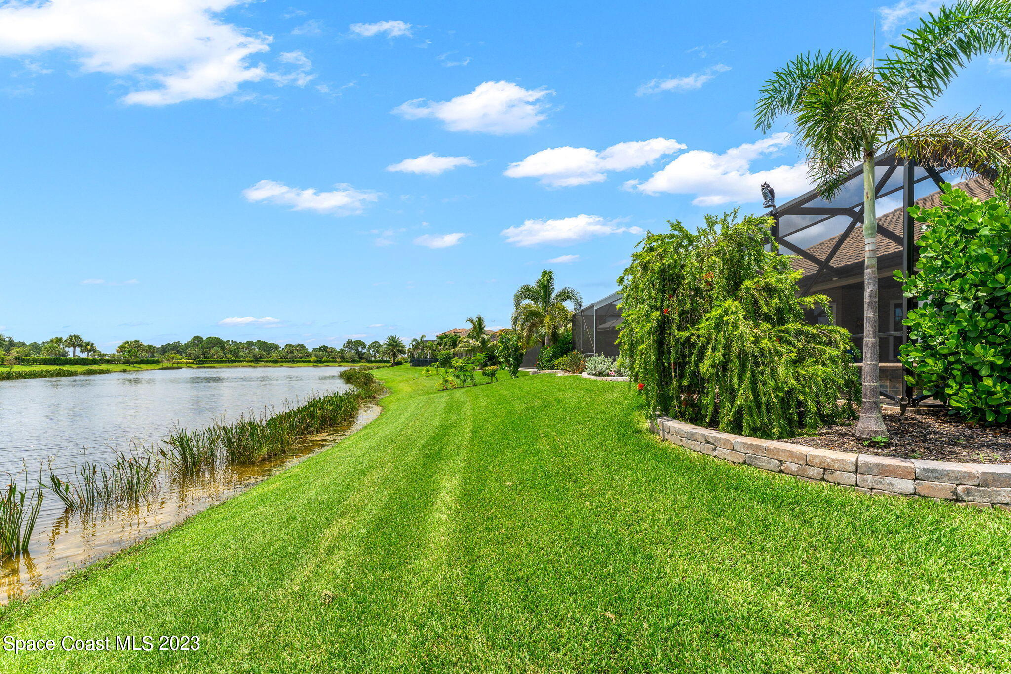 8429 Serrano Circle Melbourne, FL 32940 - Photo 21 of 28 a view of a lake from a yard