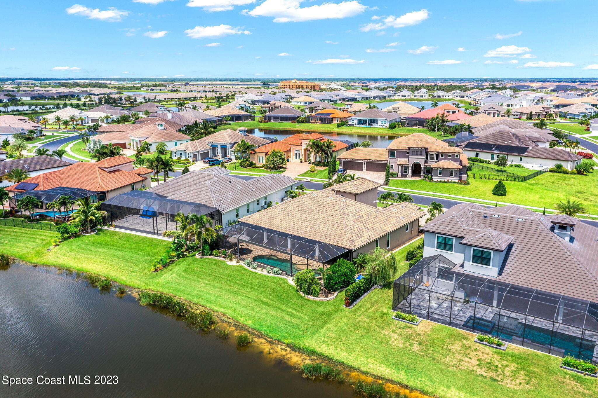 8429 Serrano Circle Melbourne, FL 32940 - Photo 23 of 28 an aerial view of multiple houses with yard