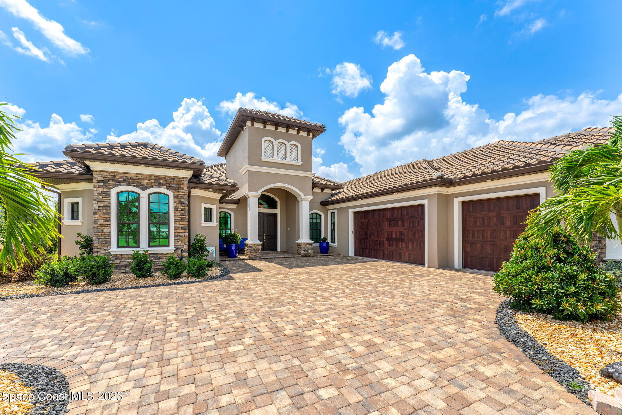 8429 Serrano Circle Melbourne, FL 32940 - Photo 28 of 28 a view of a house with a yard and potted plants