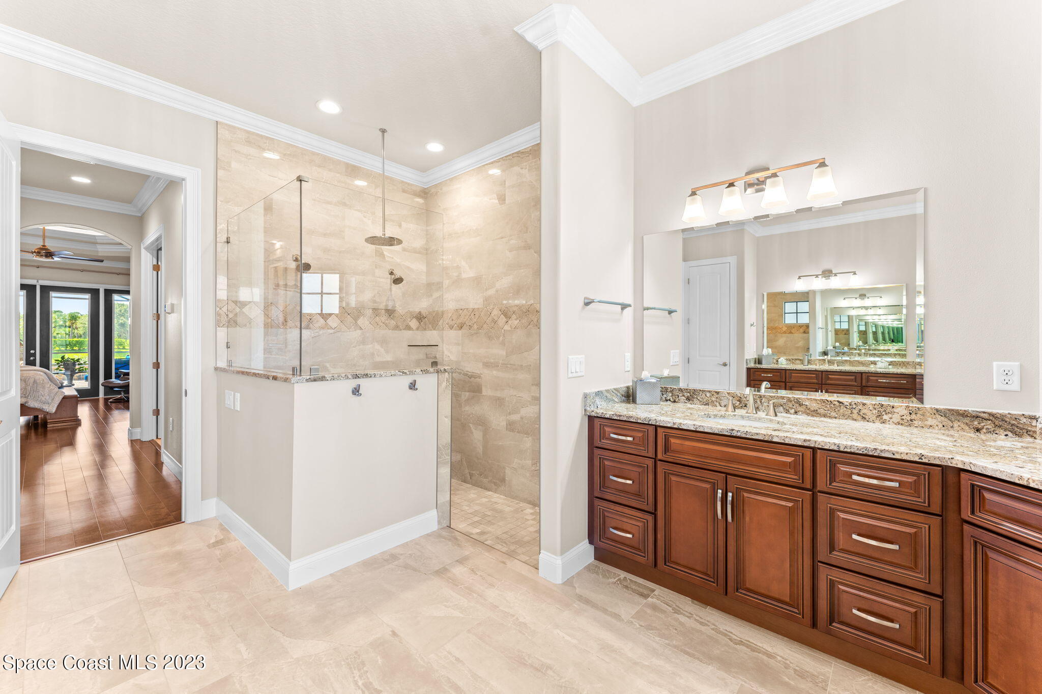 8429 Serrano Circle Melbourne, FL 32940 - Photo 9 of 28 a bathroom with a granite countertop sink mirror and double