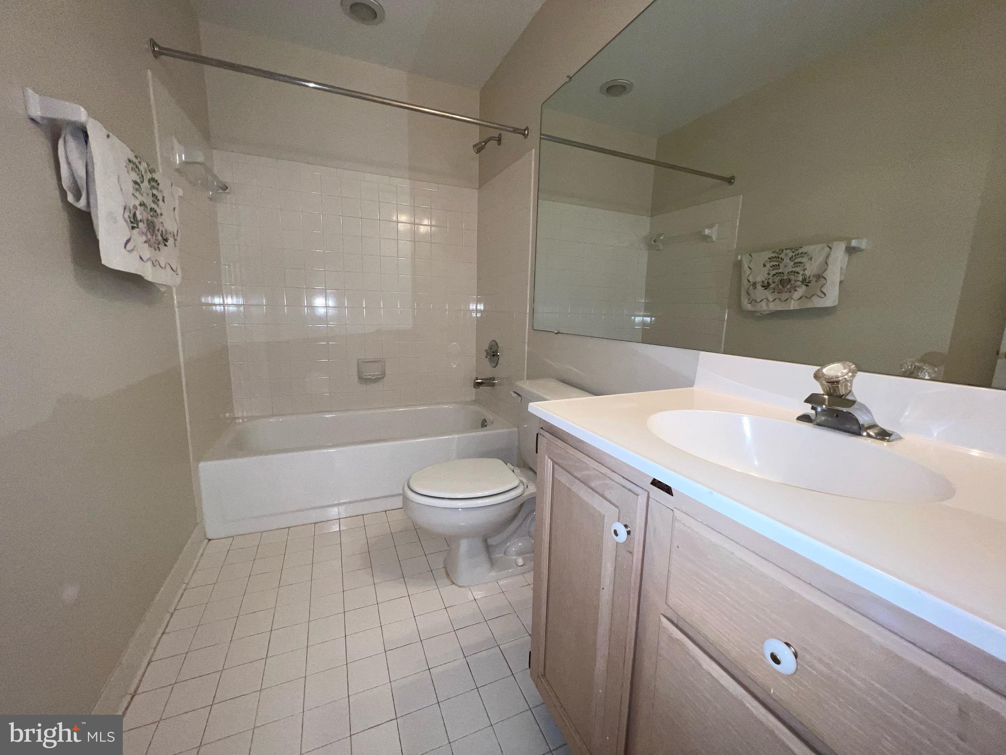 2104 Patty Lane Vienna, VA 22182 - Photo 15 of 19 a bathroom with a sink a toilet and shower