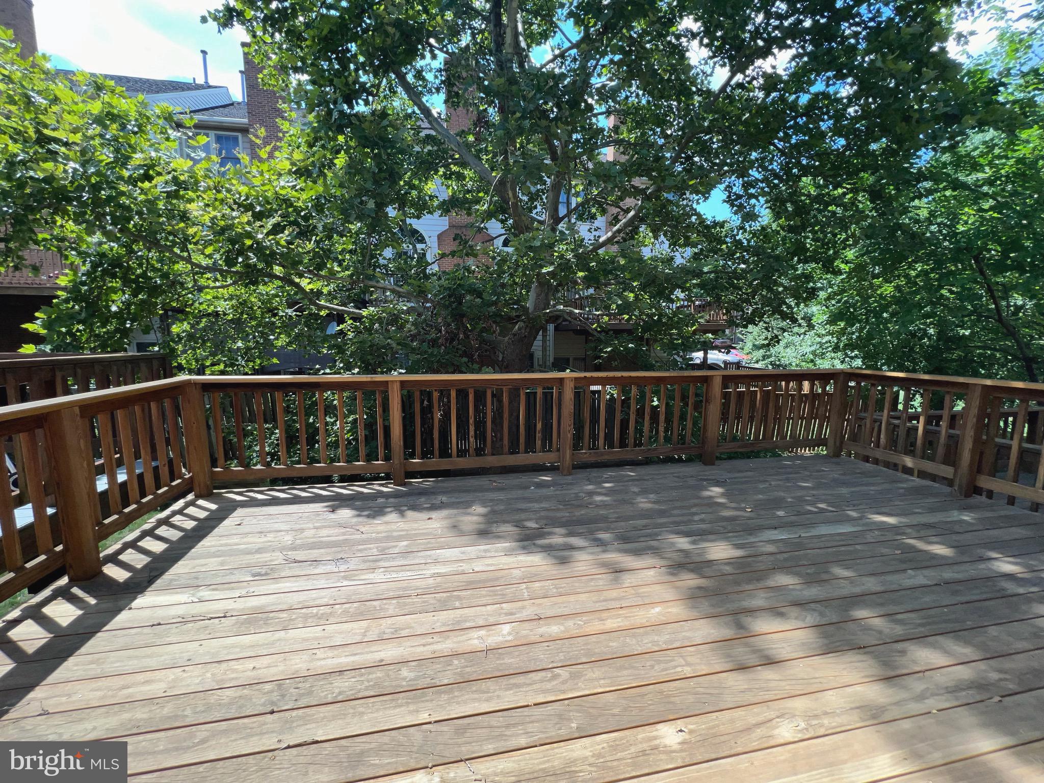 2104 Patty Lane Vienna, VA 22182 - Photo 6 of 19 a view of deck with wooden floor and fence