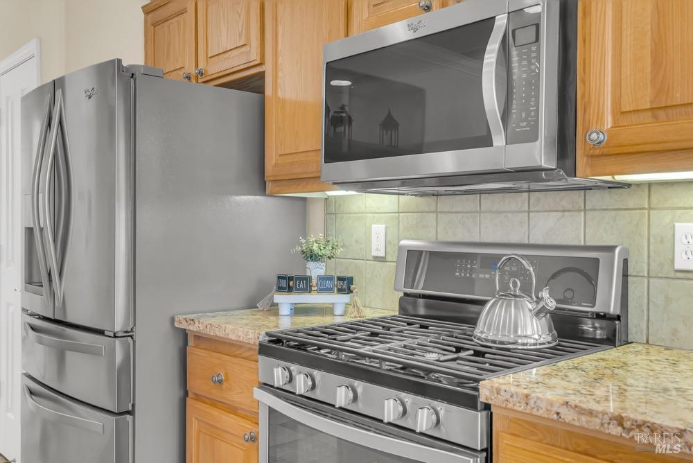110 Foxwood Lane Rio Vista, CA 94571 - Photo 16 of 79 a kitchen with stainless steel appliances granite countertop a stove and a refrigerator