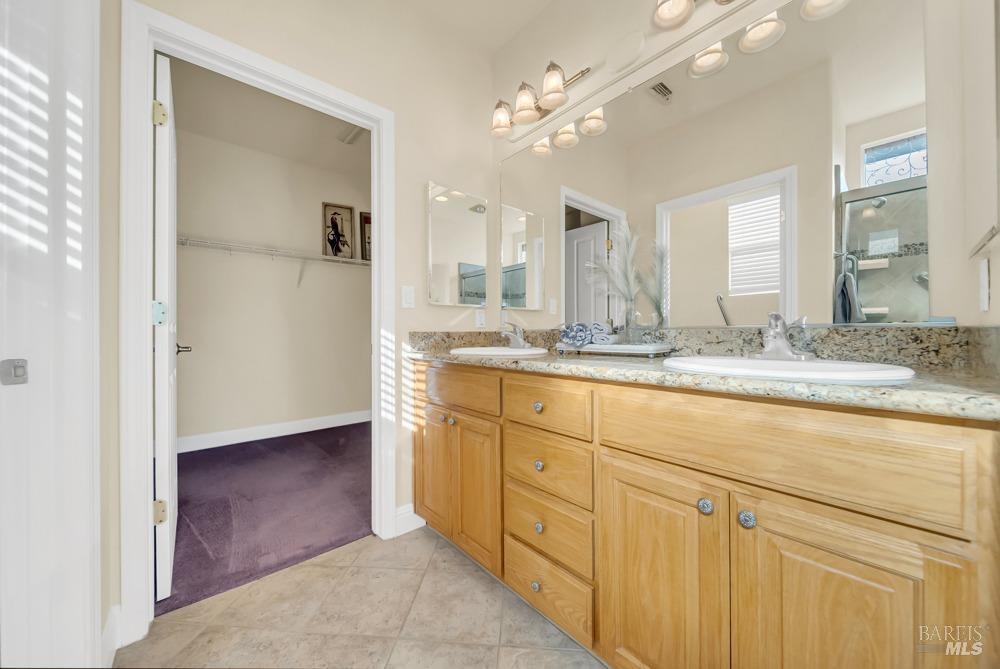 110 Foxwood Lane Rio Vista, CA 94571 - Photo 24 of 79 a bathroom with a granite countertop sink mirror and cabinets