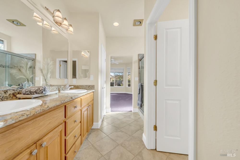 110 Foxwood Lane Rio Vista, CA 94571 - Photo 26 of 79 a spacious bathroom with a granite countertop sink a mirror and a bathtub