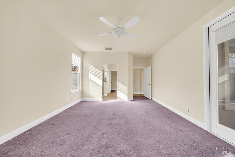 110 Foxwood Lane Rio Vista, CA 94571 - Photo 27 of 79 an empty room with a ceiling fan and a window