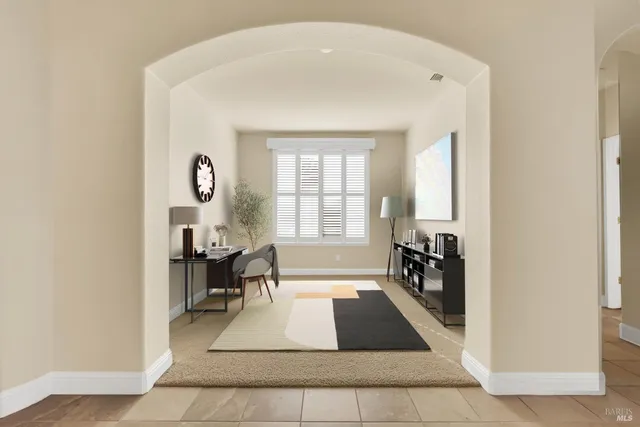 a dining room with furniture and window