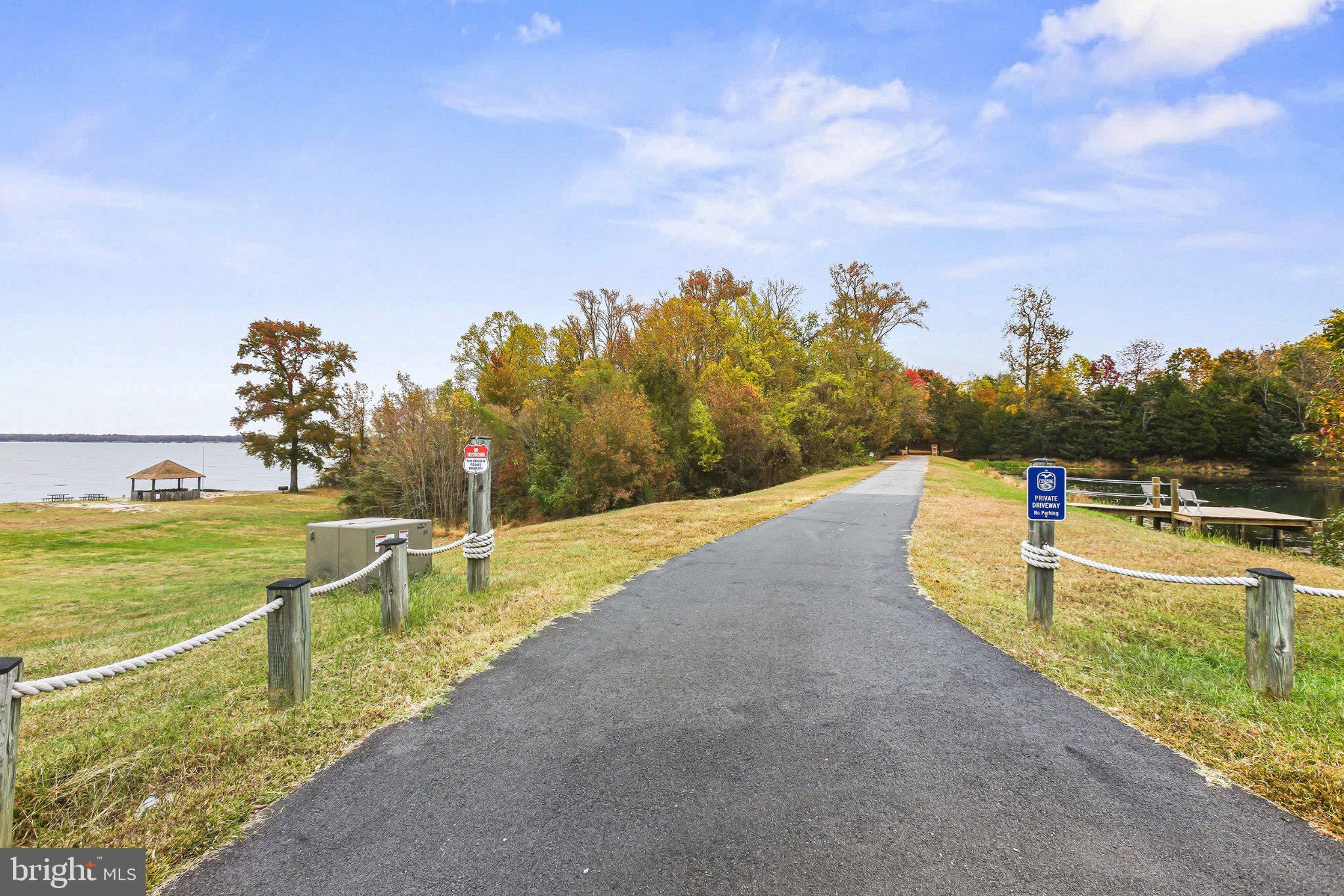 6495 Tides Road King George, VA 22485 - Photo 62 of 65 a view of a swimming pool with an outdoor seating and a garden