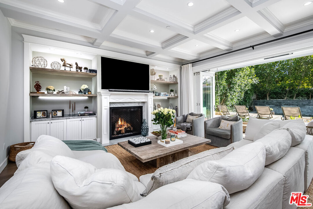 14920 Addison Street Sherman Oaks, CA 91403 - Photo 14 of 52 a living room with furniture fireplace and a large window