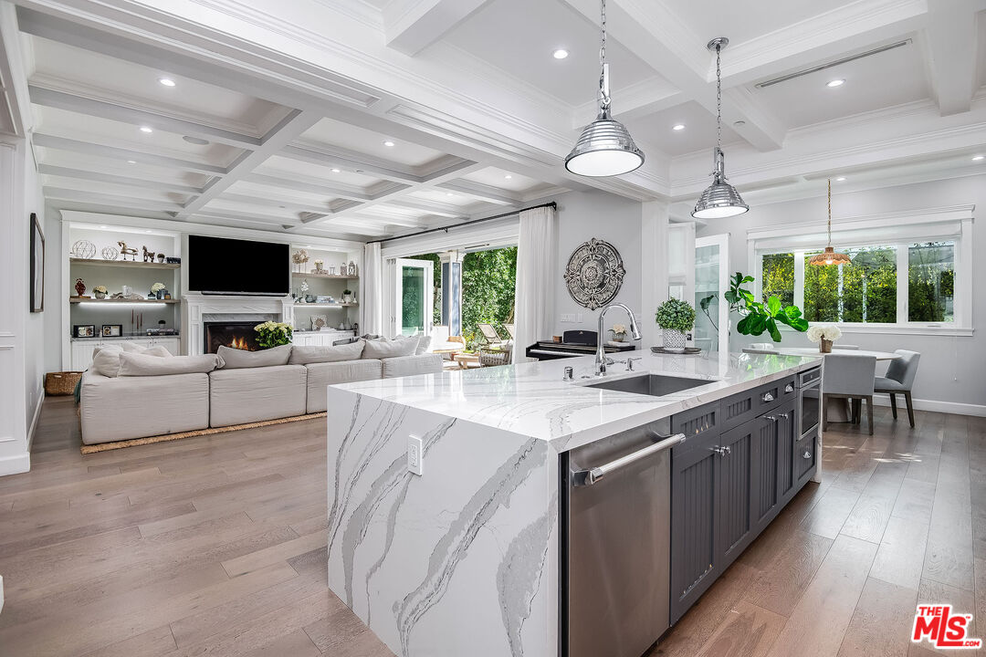 14920 Addison Street Sherman Oaks, CA 91403 - Photo 20 of 52 a large kitchen with a large counter space a sink appliances and a large window