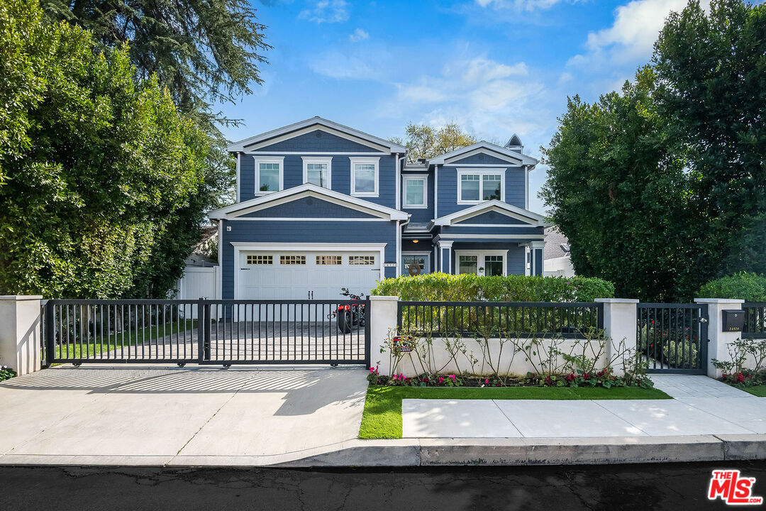 14920 Addison Street Sherman Oaks, CA 91403 - Photo 2 of 52 a front view of a house with a garden and yard