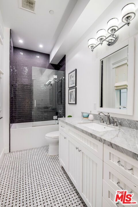 14920 Addison Street Sherman Oaks, CA 91403 - Photo 23 of 52 a bathroom with a sink a toilet and shower