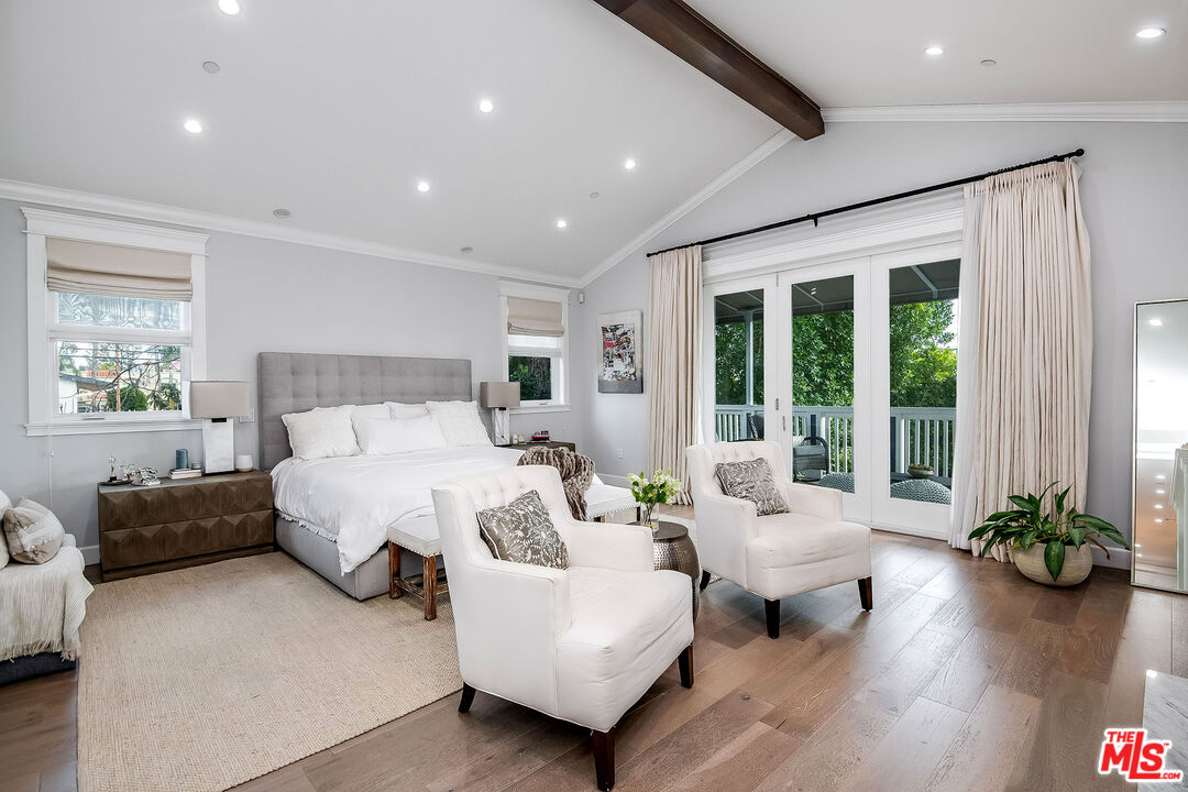 14920 Addison Street Sherman Oaks, CA 91403 - Photo 25 of 52 a spacious bedroom with a bed and a couch