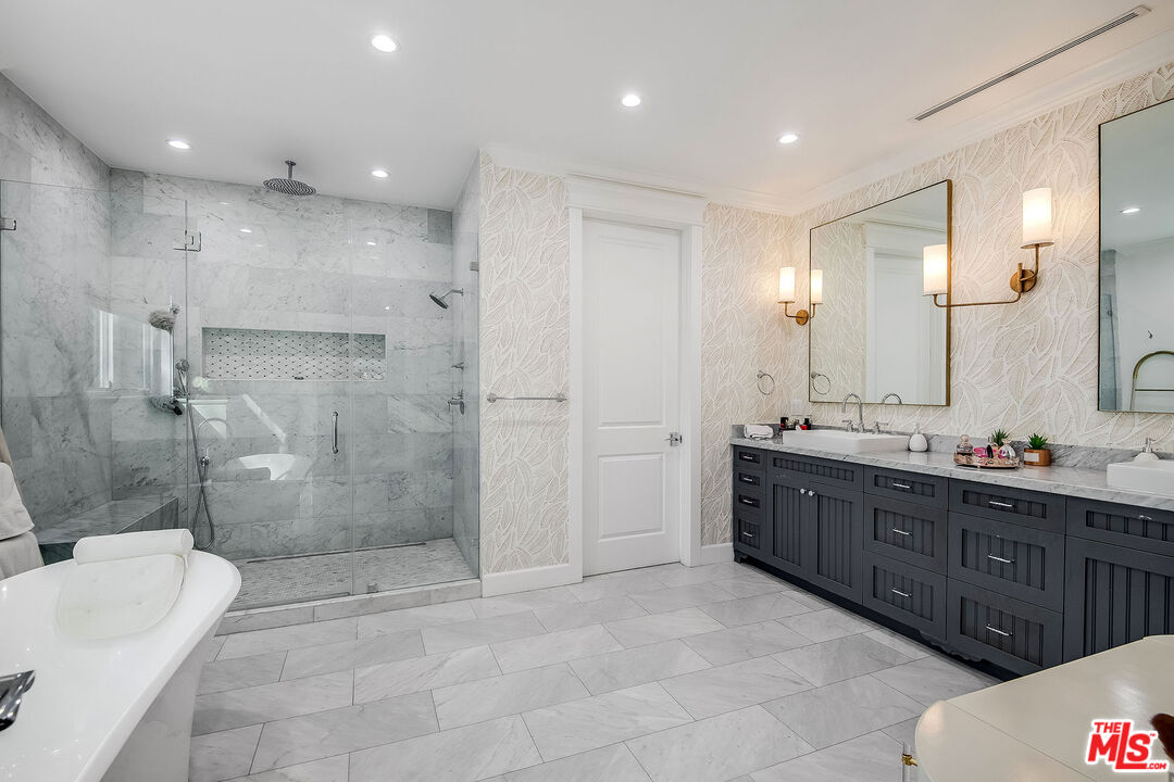 14920 Addison Street Sherman Oaks, CA 91403 - Photo 27 of 52 a bathroom with a sink a toilet and shower