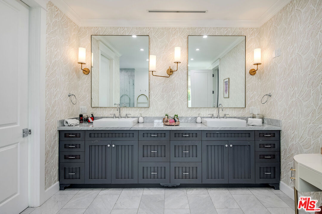 14920 Addison Street Sherman Oaks, CA 91403 - Photo 28 of 52 a bathroom with a double vanity sink double and mirror