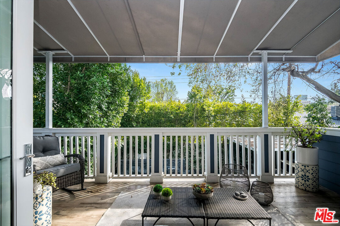 14920 Addison Street Sherman Oaks, CA 91403 - Photo 31 of 52 a view of porch with a furniture