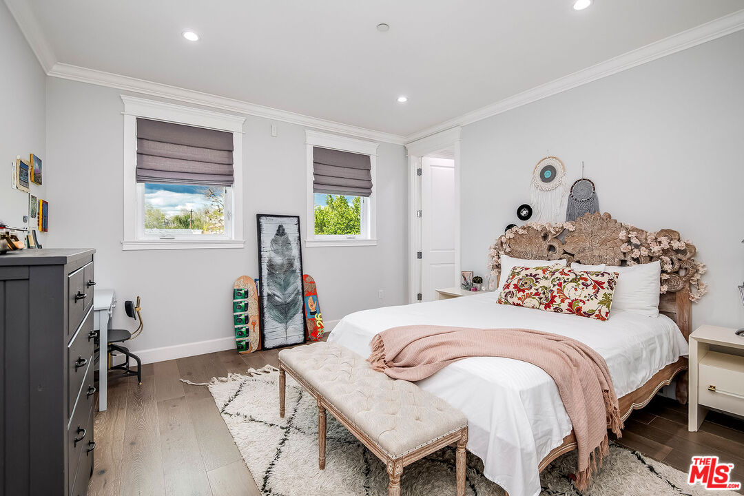 14920 Addison Street Sherman Oaks, CA 91403 - Photo 35 of 52 a bedroom with a bed and a window