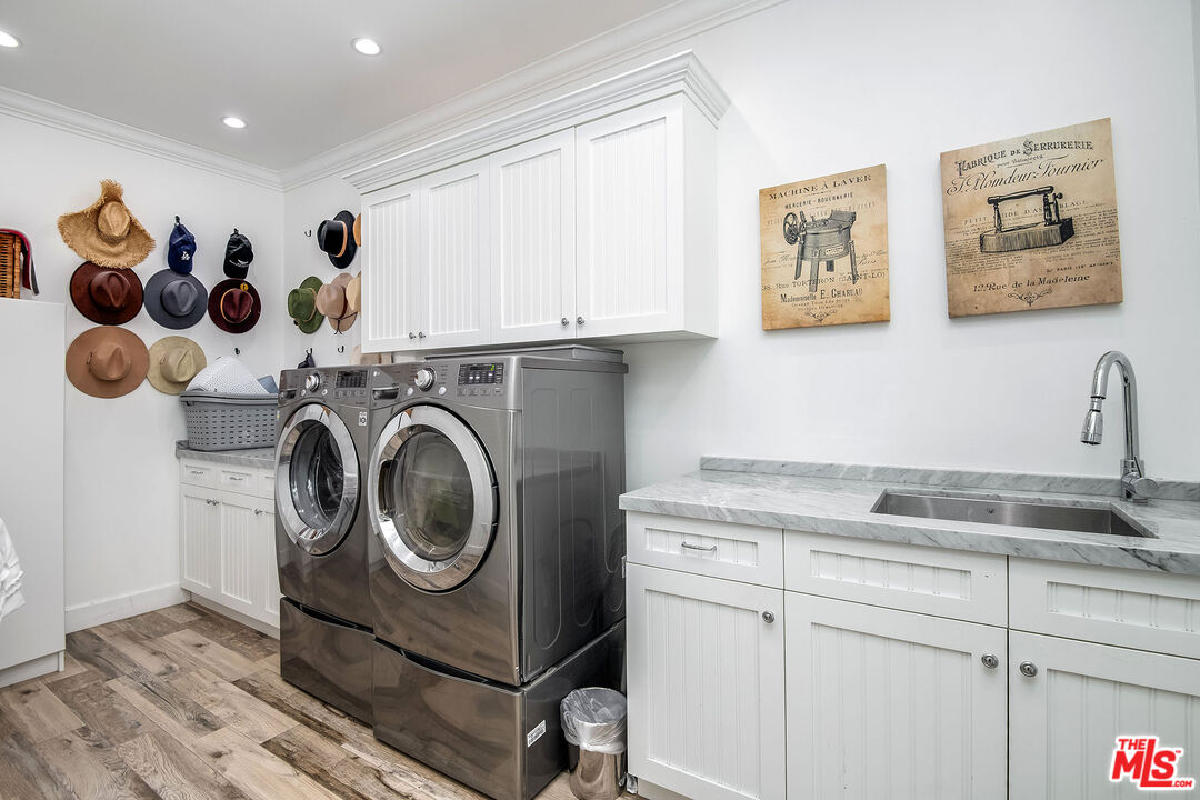 14920 Addison Street Sherman Oaks, CA 91403 - Photo 42 of 52 a utility room with sink dryer and washer