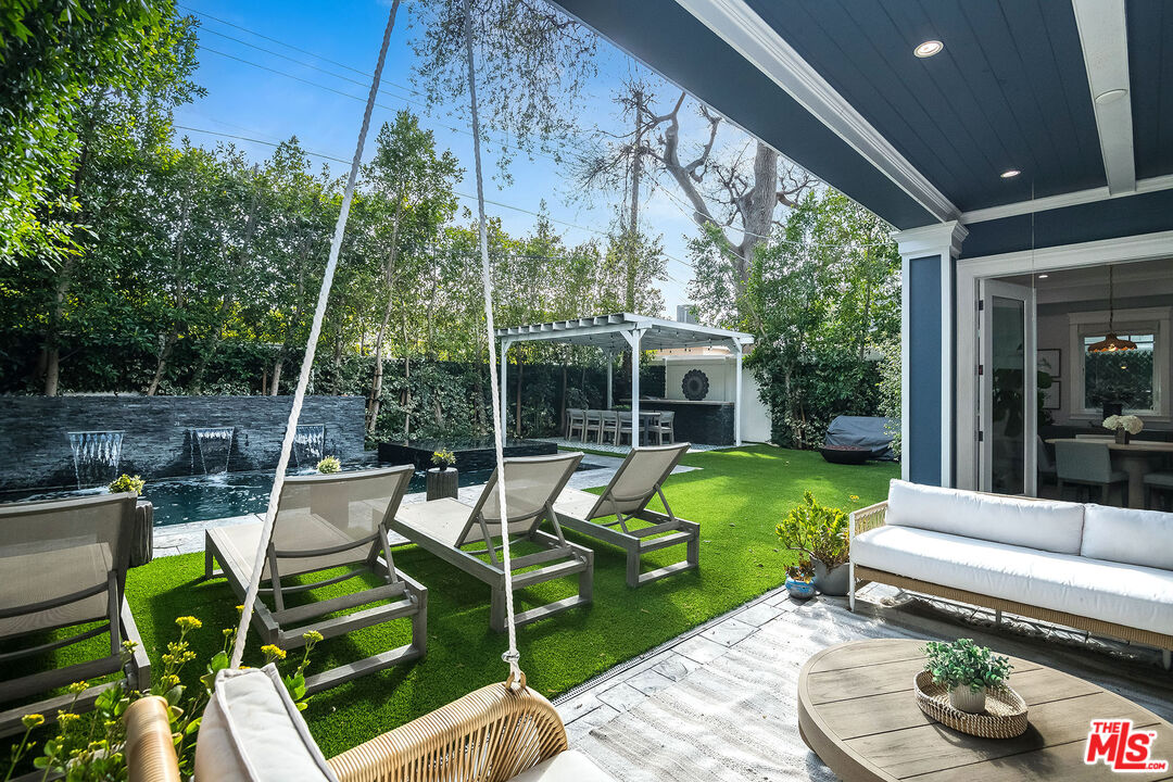 14920 Addison Street Sherman Oaks, CA 91403 - Photo 45 of 52 a view of a chair and tables in the patio