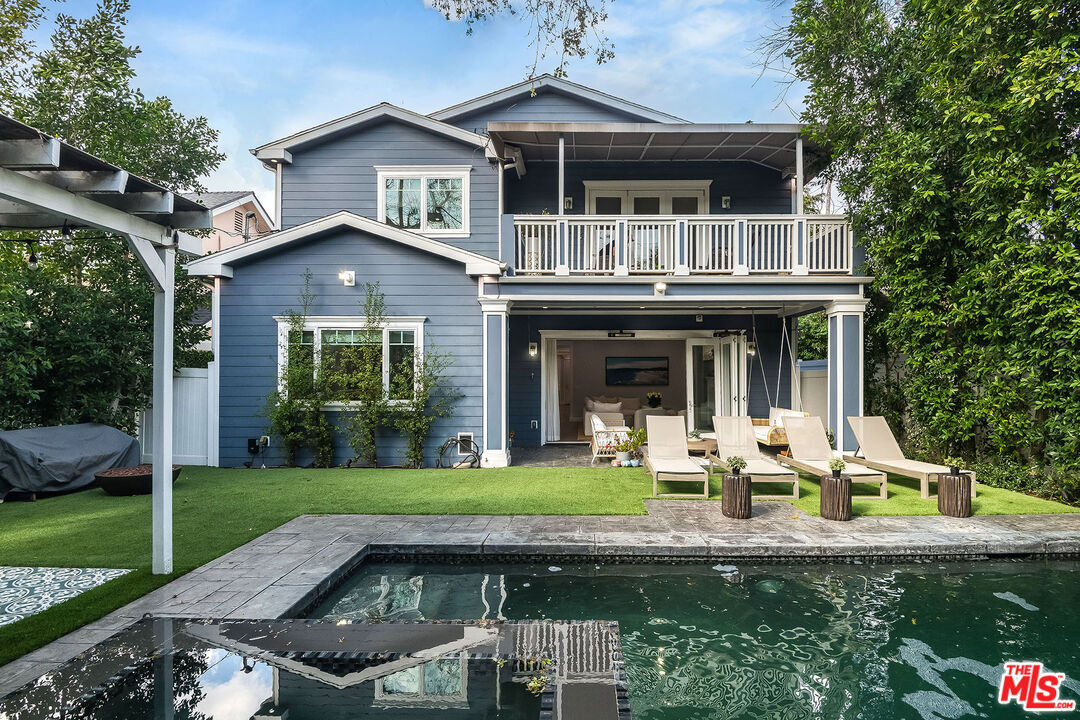 14920 Addison Street Sherman Oaks, CA 91403 - Photo 51 of 52 a front view of a house with garden