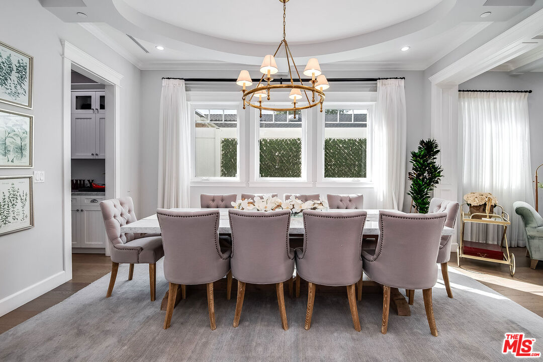 14920 Addison Street Sherman Oaks, CA 91403 - Photo 10 of 52 a view of a dining room with furniture wooden floor and chandelier