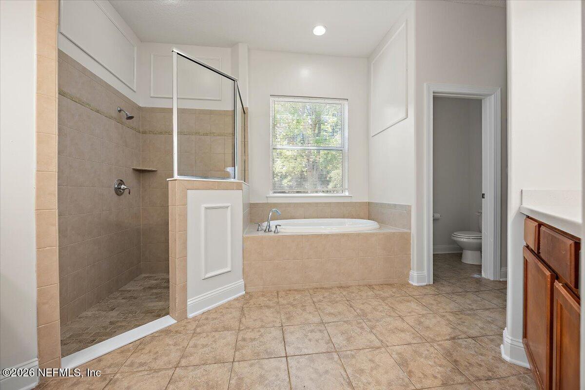 436 Chattan Way Fruit Cove, FL 32259 - Photo 15 of 41 a spacious bathroom with a bathtub and a shower