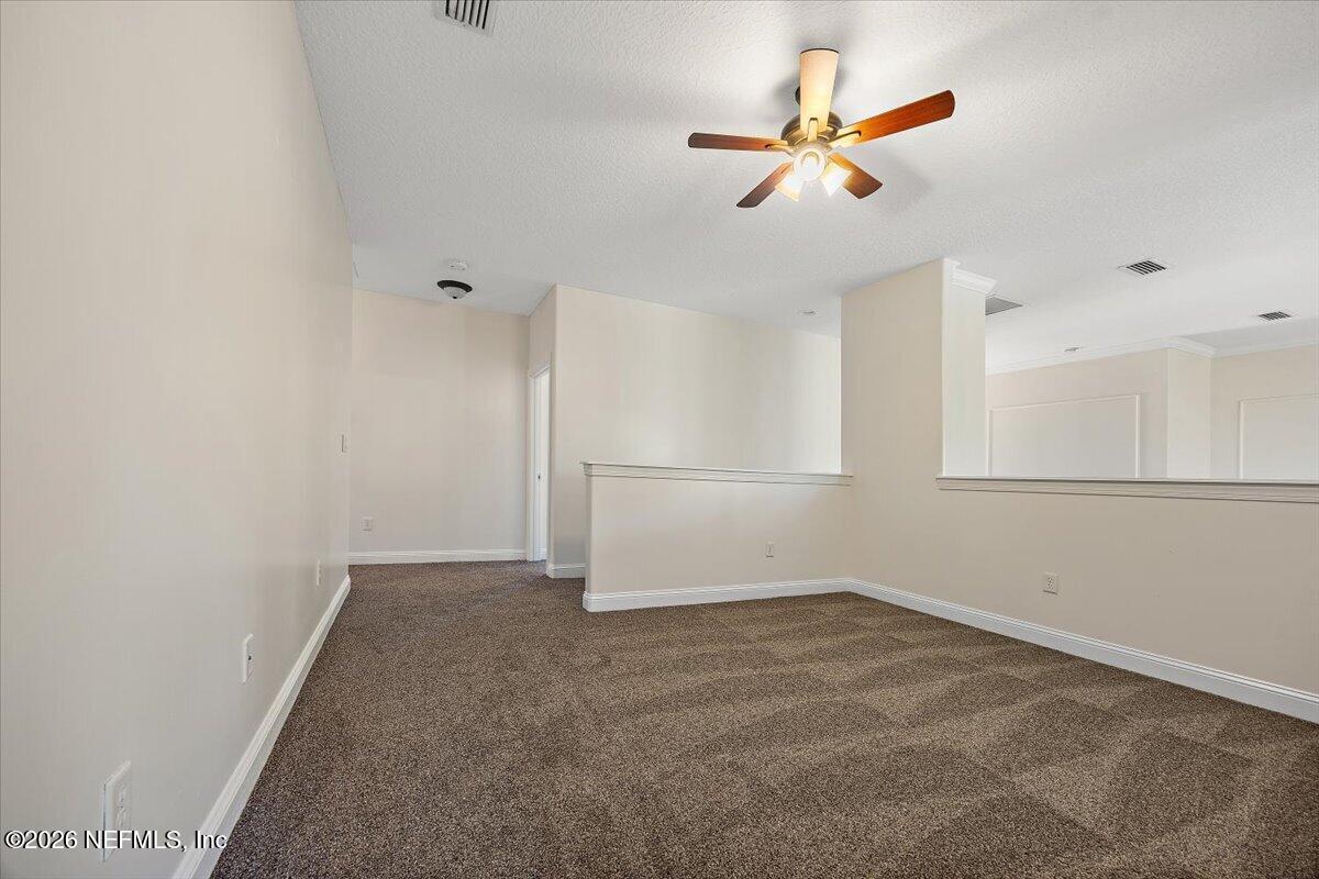 436 Chattan Way Fruit Cove, FL 32259 - Photo 20 of 41 an empty room with closet and ceiling fan