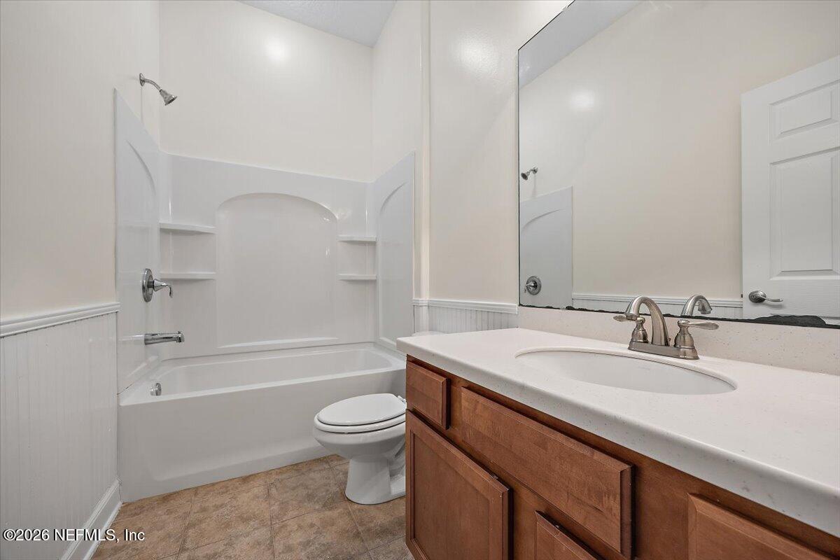 436 Chattan Way Fruit Cove, FL 32259 - Photo 23 of 41 a bathroom with a granite countertop sink a toilet and bathtub