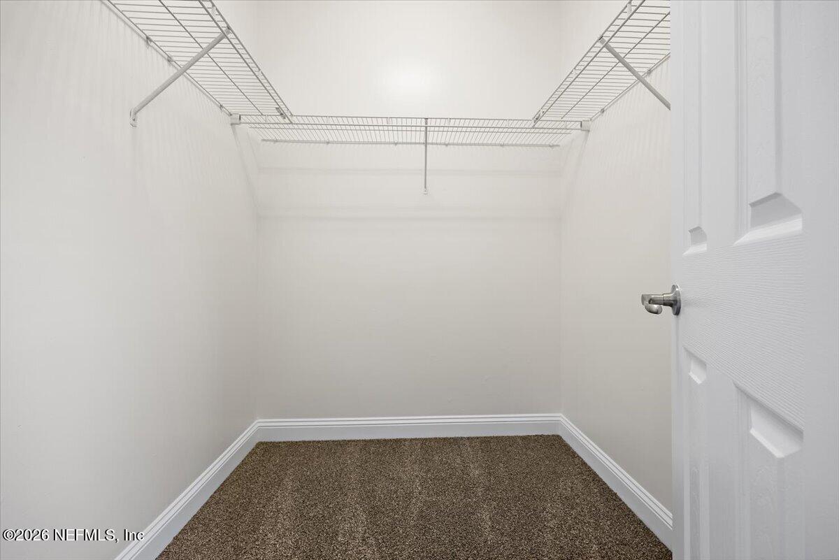 436 Chattan Way Fruit Cove, FL 32259 - Photo 25 of 41 a view of a room with racks on the wall