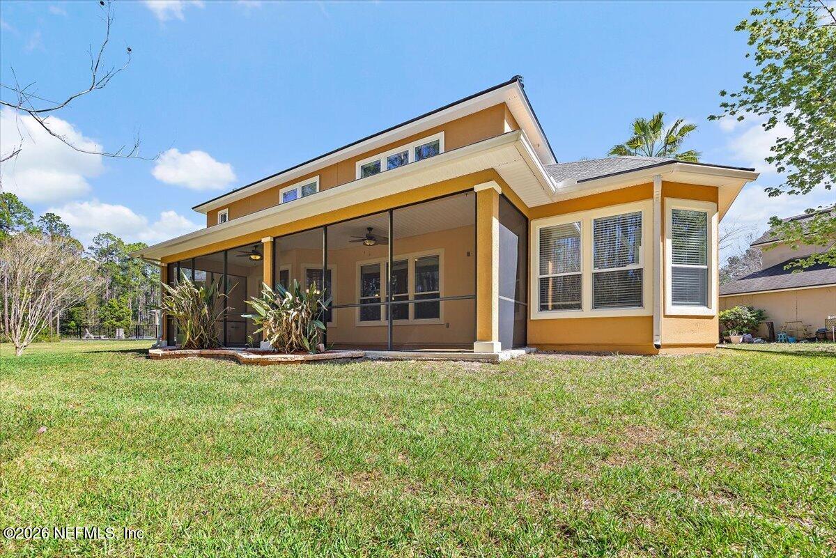 436 Chattan Way Fruit Cove, FL 32259 - Photo 31 of 41 a front view of a house with a yard