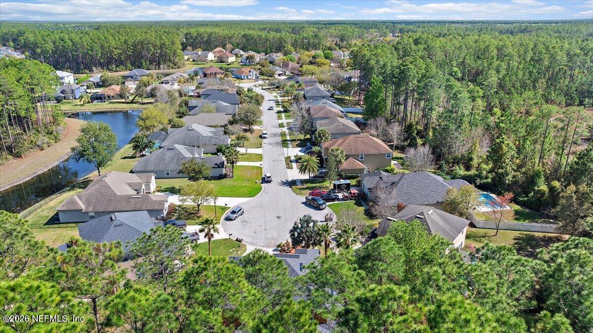 436 Chattan Way Fruit Cove, FL 32259 - Photo 37 of 41 an aerial view of a house with a garden and lake view