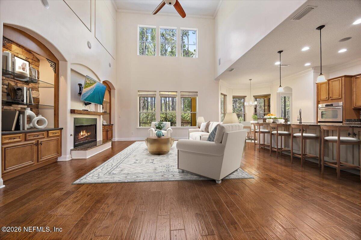 436 Chattan Way Fruit Cove, FL 32259 - Photo 4 of 41 a living room with furniture fireplace and flat screen tv