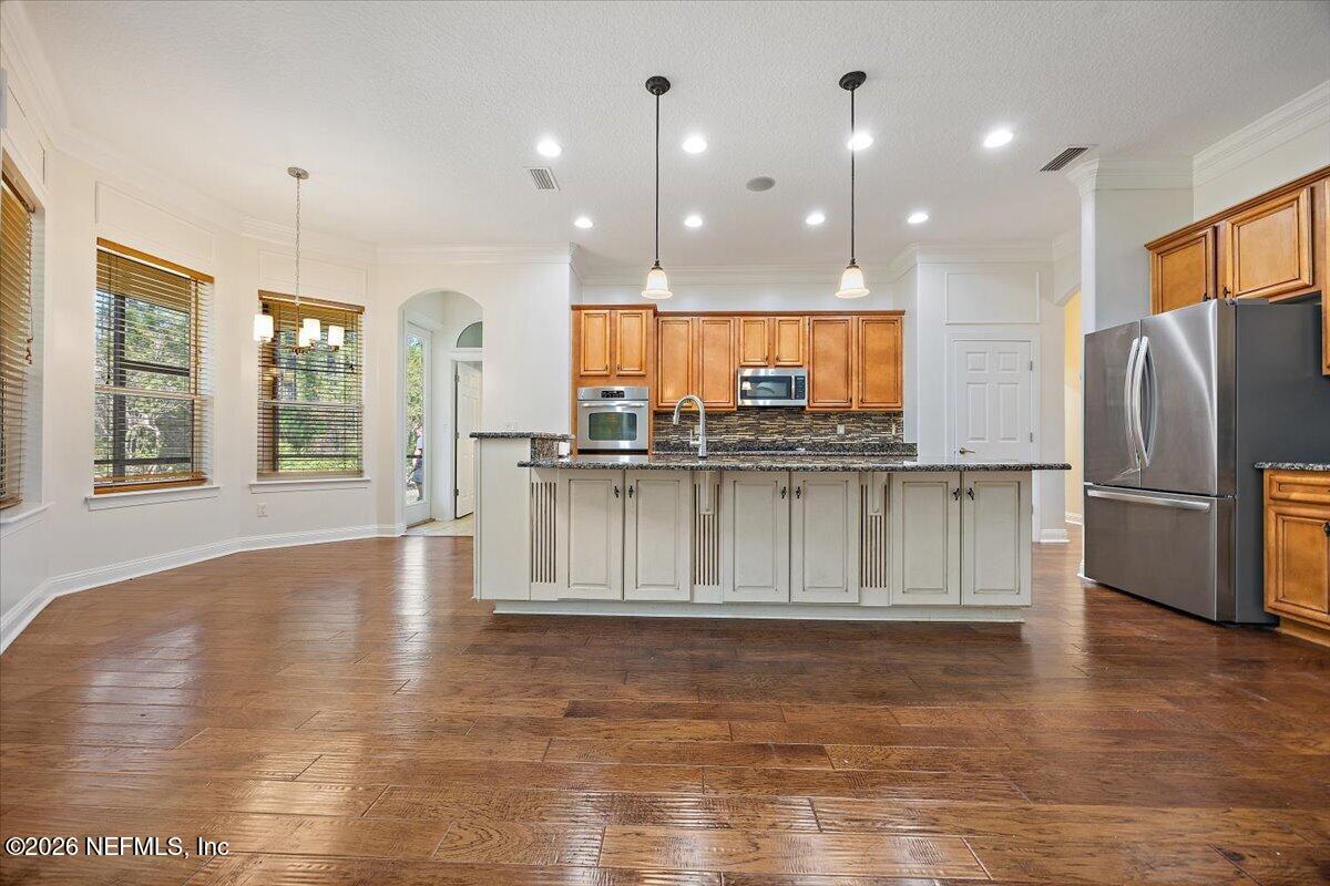 436 Chattan Way Fruit Cove, FL 32259 - Photo 7 of 41 a view of kitchen and kitchen with granite countertop a stove top oven