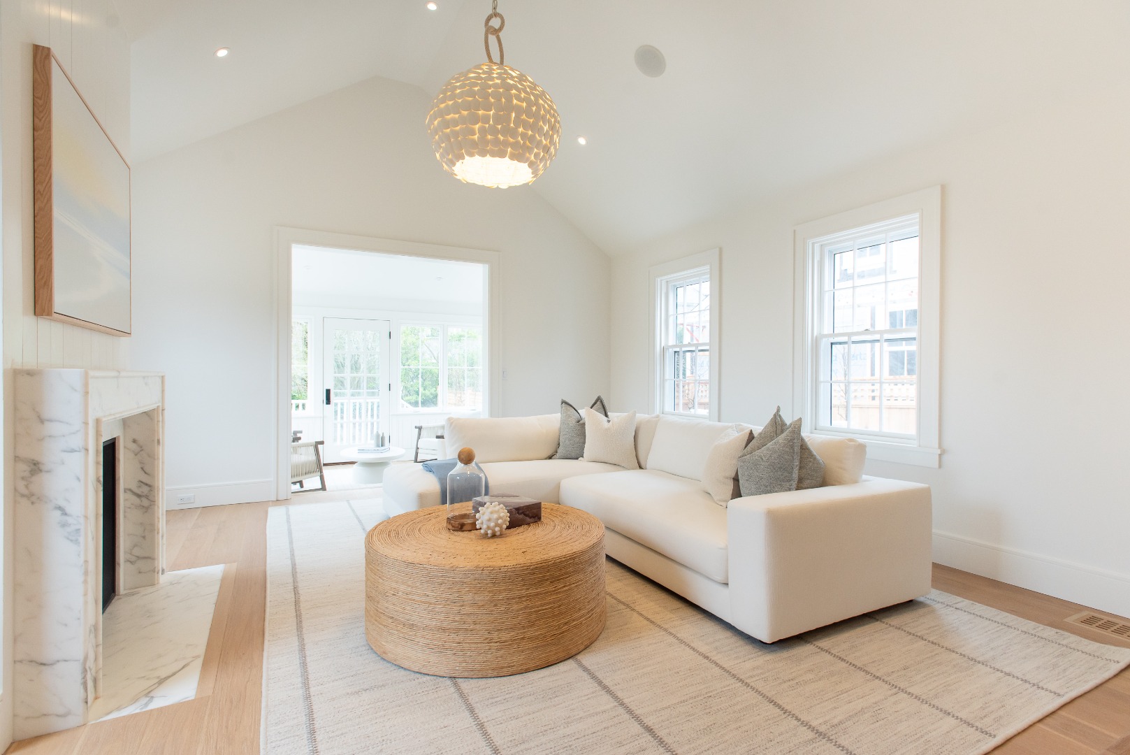10 Silver Street Nantucket, MA 02554 - Photo 21 of 48 a living room with furniture and a chandelier
