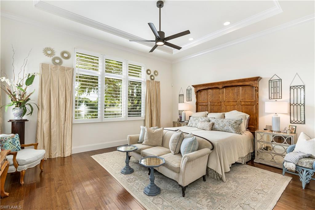 16727 Lucarno Way Naples, FL 34110 - Photo 17 of 36 a bedroom with a bed and a couch