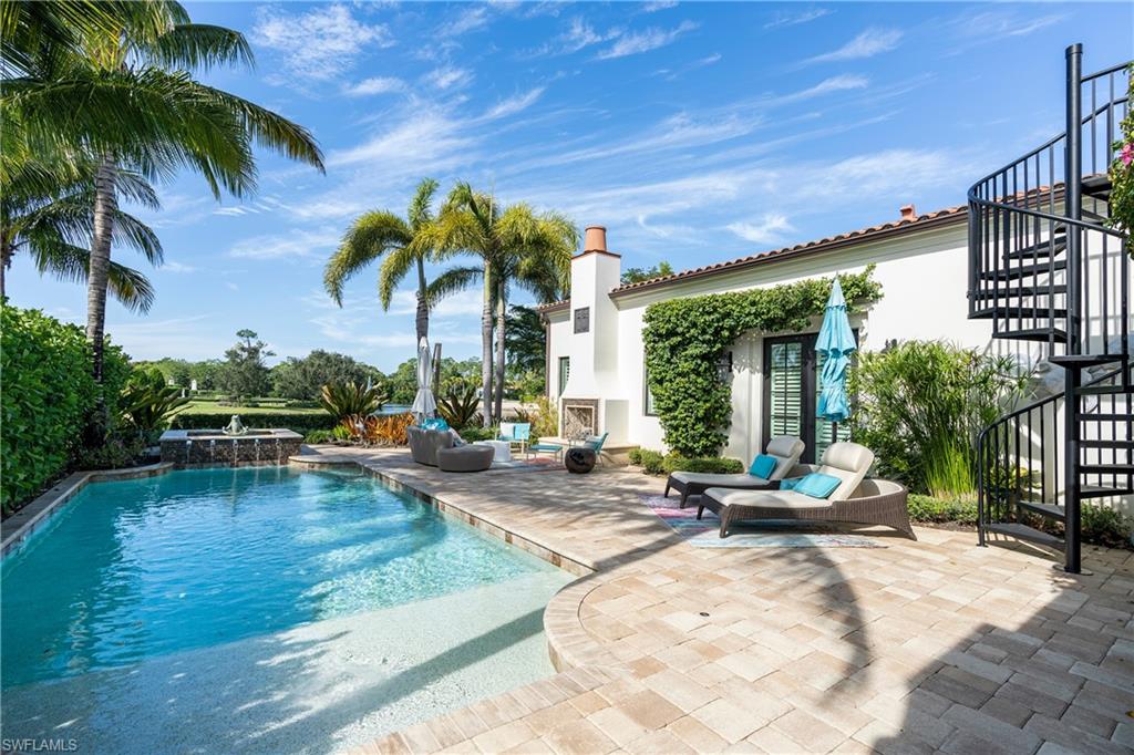 16727 Lucarno Way Naples, FL 34110 - Photo 20 of 48 a view of a house with swimming pool and sitting area