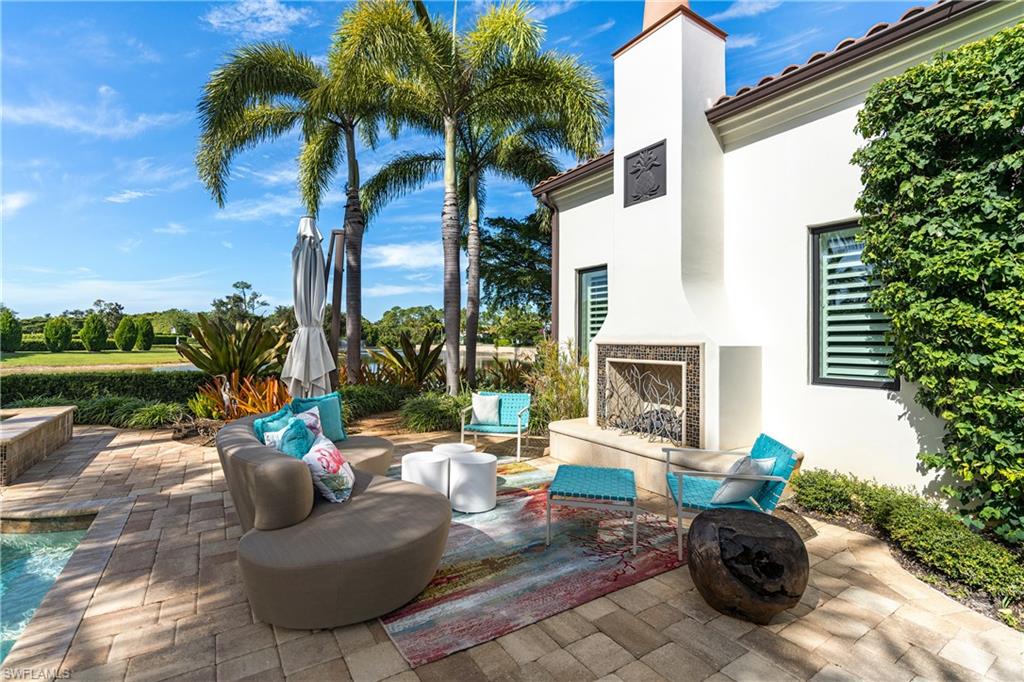 16727 Lucarno Way Naples, FL 34110 - Photo 21 of 48 a view of a patio with couches and a fire pit