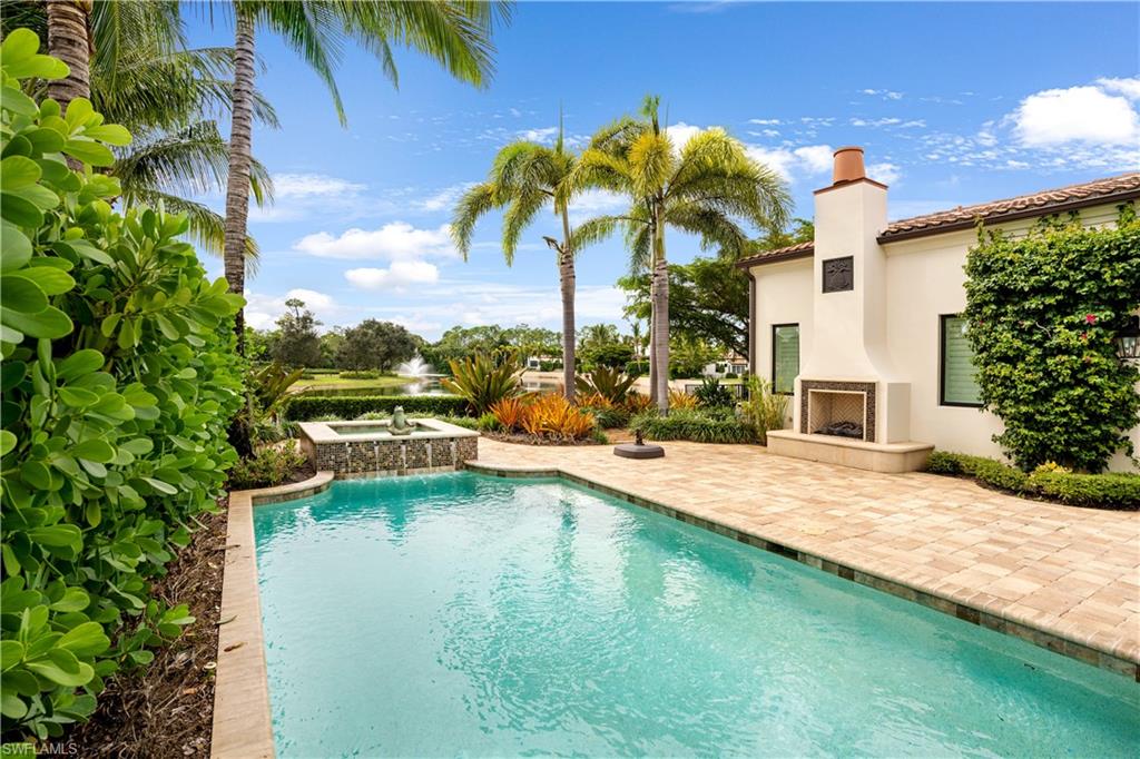 16727 Lucarno Way Naples, FL 34110 - Photo 21 of 36 a swimming pool with outdoor seating and yard