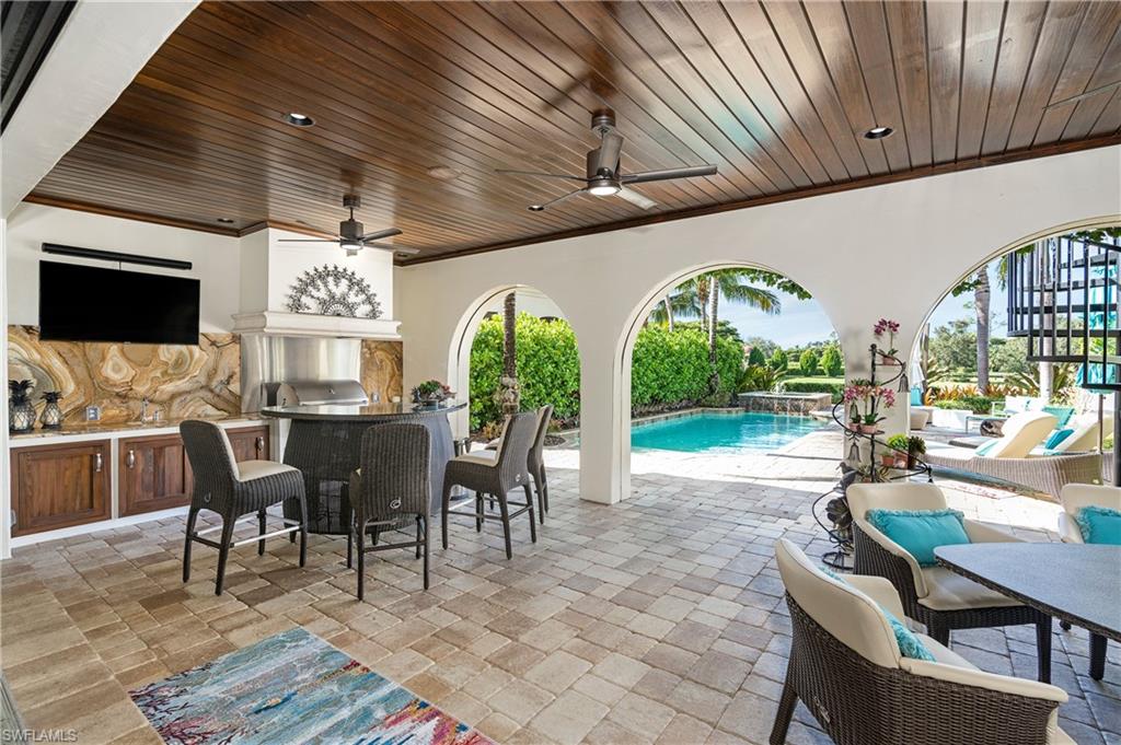 16727 Lucarno Way Naples, FL 34110 - Photo 22 of 48 a view of a dining area with furniture window and outside view