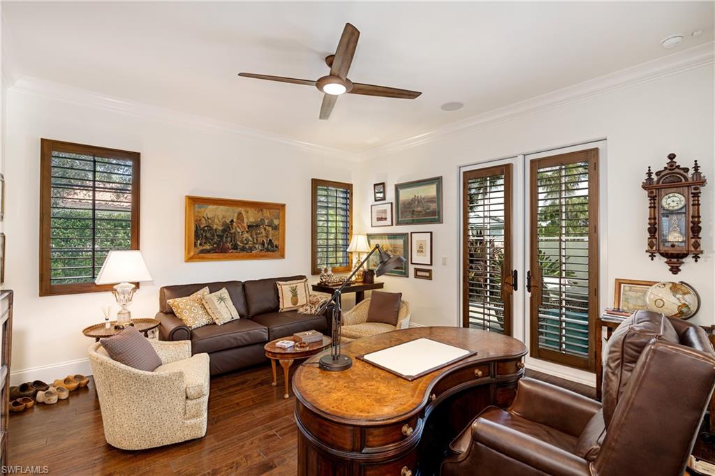 16727 Lucarno Way Naples, FL 34110 - Photo 28 of 48 a living room with furniture and a large window