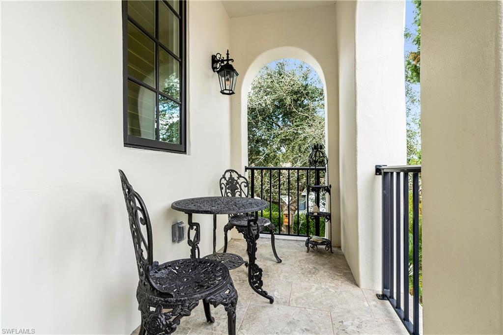 16727 Lucarno Way Naples, FL 34110 - Photo 38 of 48 a view of a workspace with furniture and a window