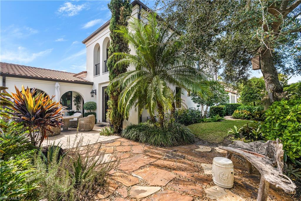 16727 Lucarno Way Naples, FL 34110 - Photo 4 of 36 a view of a house with a yard and sitting area