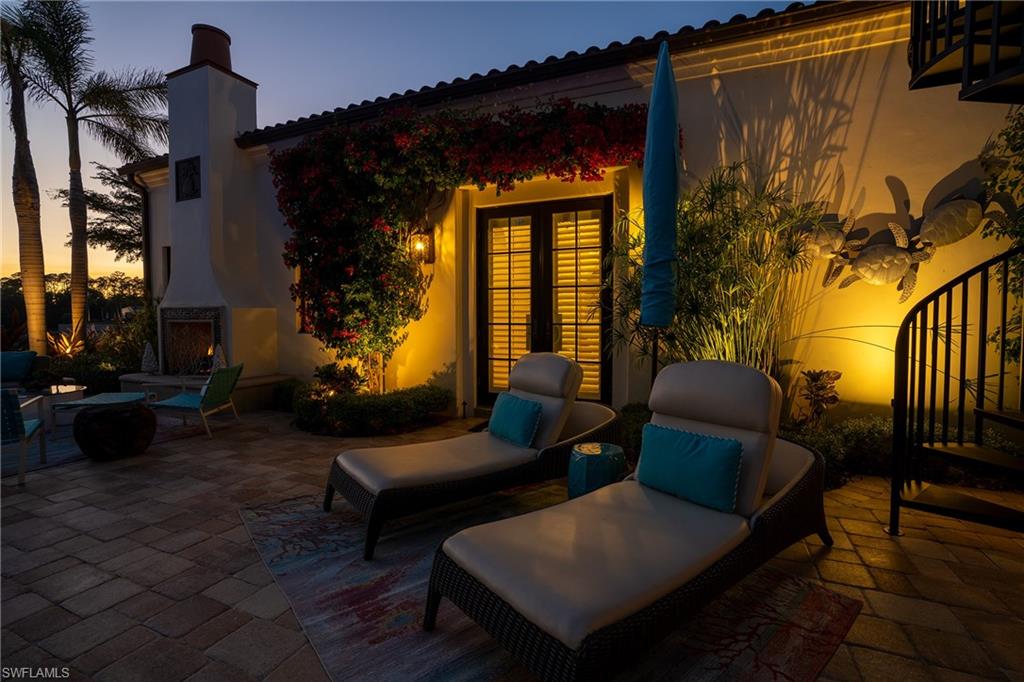 16727 Lucarno Way Naples, FL 34110 - Photo 44 of 48 a outdoor living space with furniture and a potted plant
