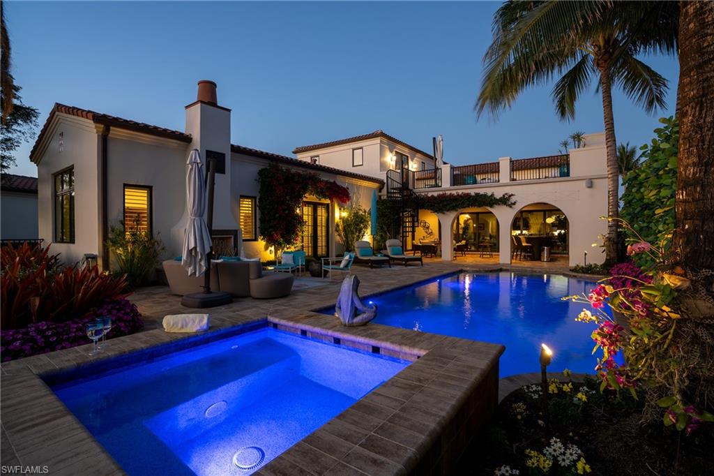 16727 Lucarno Way Naples, FL 34110 - Photo 45 of 48 a view of a house with swimming pool and sitting area