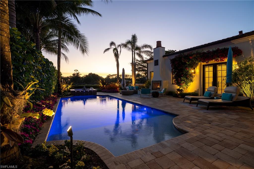 16727 Lucarno Way Naples, FL 34110 - Photo 47 of 48 a view of a swimming pool with a patio