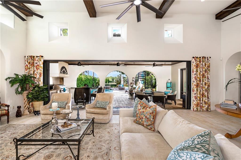 16727 Lucarno Way Naples, FL 34110 - Photo 6 of 36 a living room with furniture