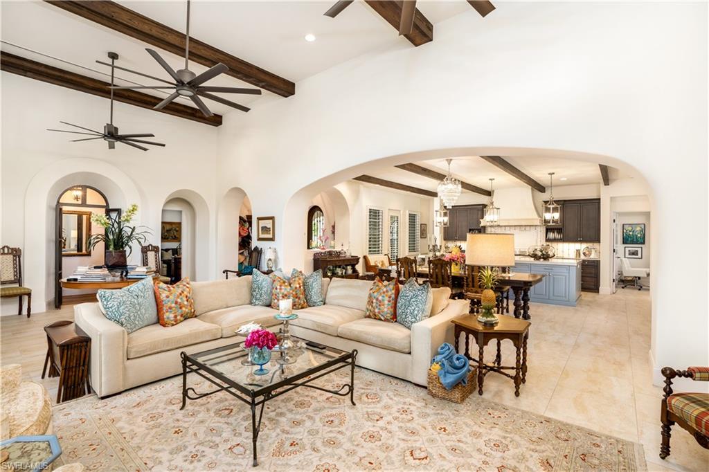16727 Lucarno Way Naples, FL 34110 - Photo 7 of 36 a living room with furniture