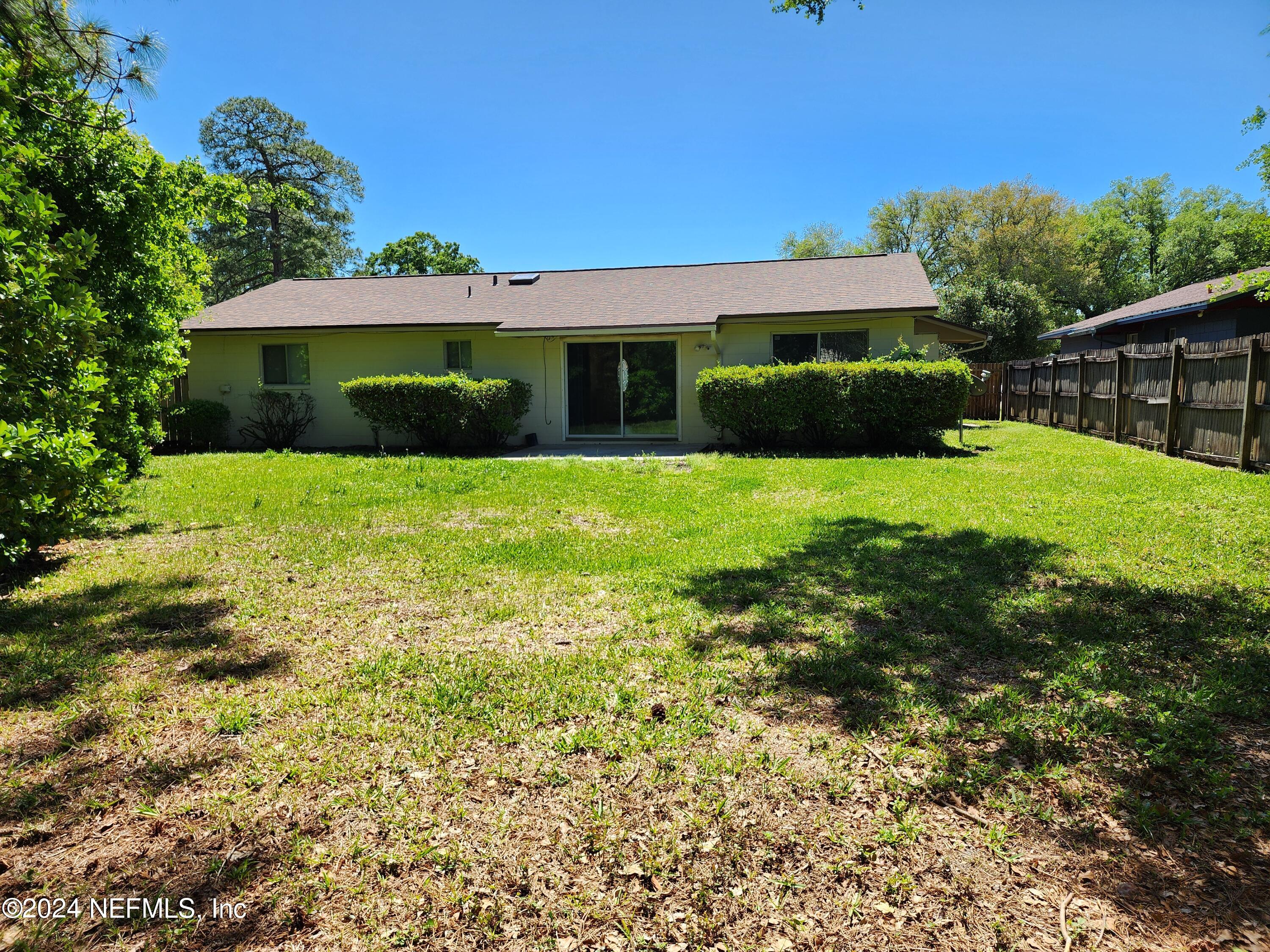 8423 Graybar Drive Jacksonville, FL 32221 - Photo 29 of 29 a front view of house with yard and green space