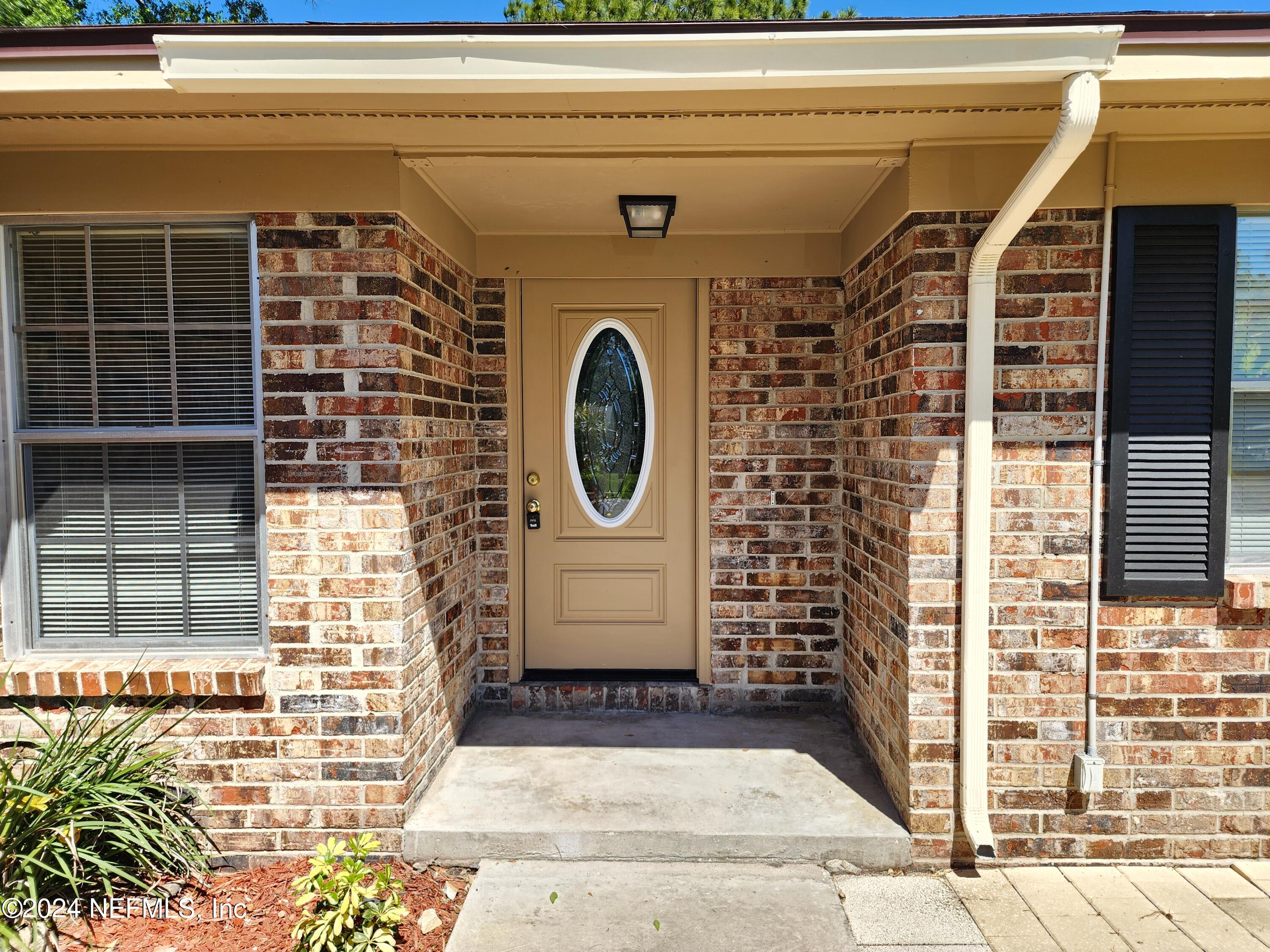 8423 Graybar Drive Jacksonville, FL 32221 - Photo 3 of 29 a front view of a house with a shower