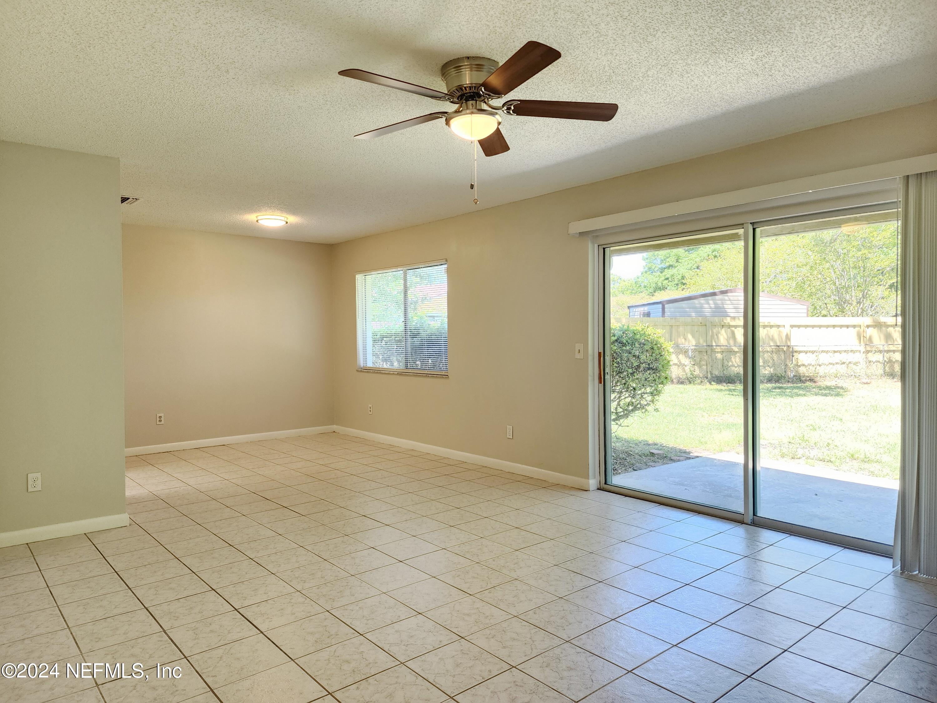 8423 Graybar Drive Jacksonville, FL 32221 - Photo 8 of 29 a view of an empty room and window